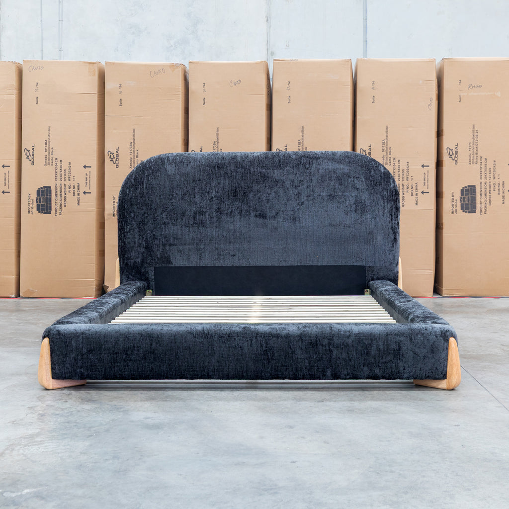 The Okina King Upholstered Bed - Black available to purchase from Warehouse Furniture Clearance at our next sale event.