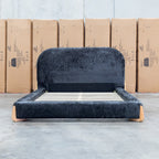 The Okina King Upholstered Bed - Black available to purchase from Warehouse Furniture Clearance at our next sale event.