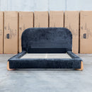 The Okina Queen Upholstered Bed - Black available to purchase from Warehouse Furniture Clearance at our next sale event.