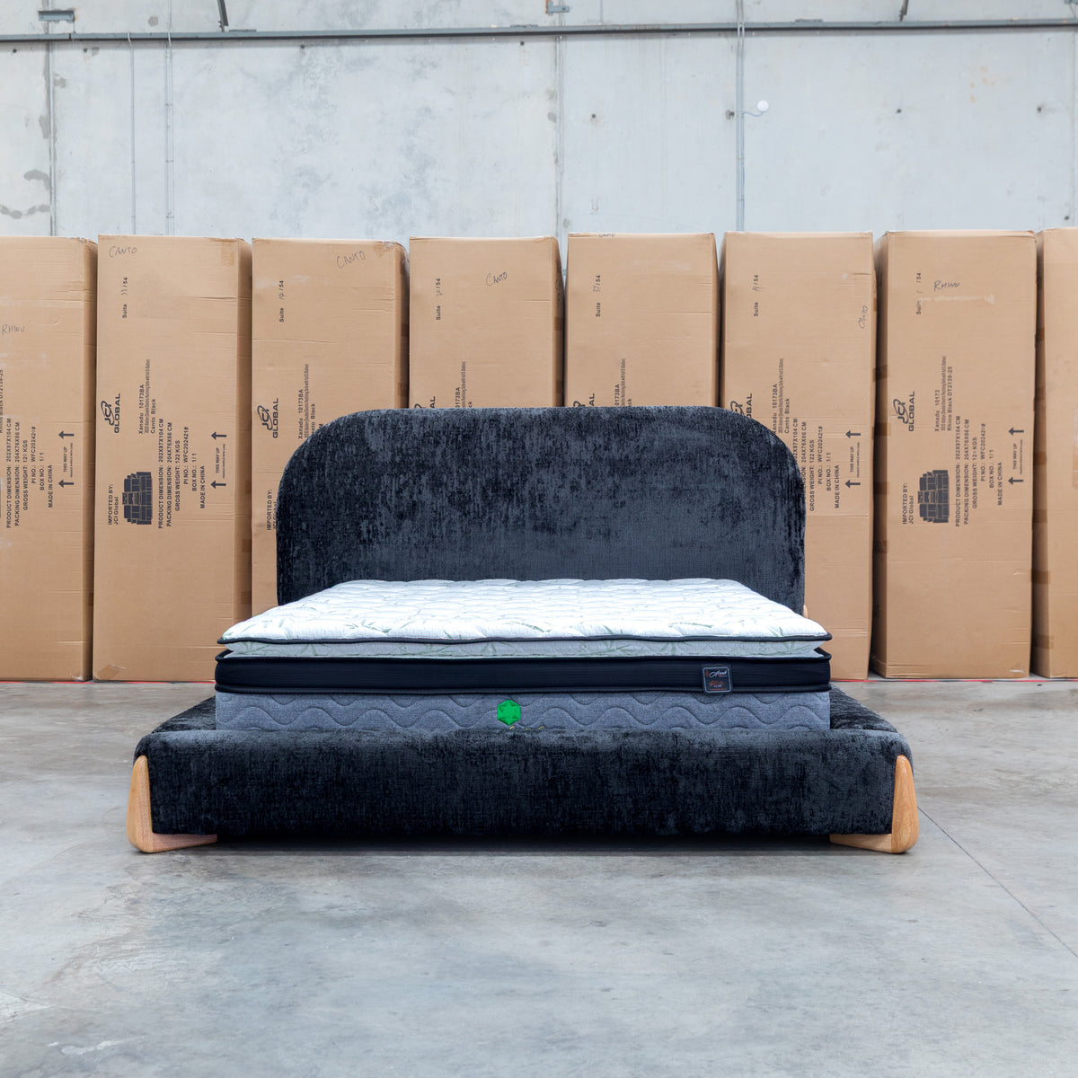 The Okina King Upholstered Bed - Black available to purchase from Warehouse Furniture Clearance at our next sale event.