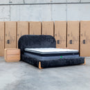 The Okina Queen Upholstered Bed - Black available to purchase from Warehouse Furniture Clearance at our next sale event.