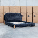 The Okina Queen Upholstered Bed - Black available to purchase from Warehouse Furniture Clearance at our next sale event.
