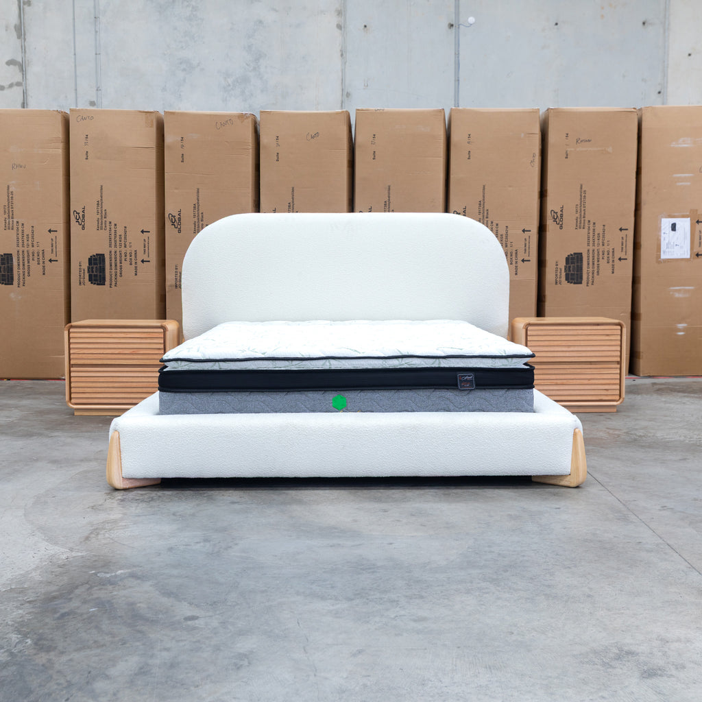 The Okina Queen Upholstered Bed - Cream available to purchase from Warehouse Furniture Clearance at our next sale event.