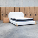 The Okina Queen Upholstered Bed - Cream available to purchase from Warehouse Furniture Clearance at our next sale event.