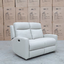 The Olsen Dual-Motor Two Seat Recliner Suite - Beige Leather available to purchase from Warehouse Furniture Clearance at our next sale event.