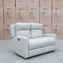 The Olsen Dual-Motor Two Seat Recliner Suite - Beige Leather available to purchase from Warehouse Furniture Clearance at our next sale event.