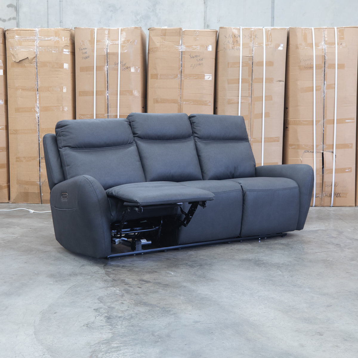 The Palm Cove Three Seater Triple Motor Electric Recliner Lounge - Coal available to purchase from Warehouse Furniture Clearance at our next sale event.