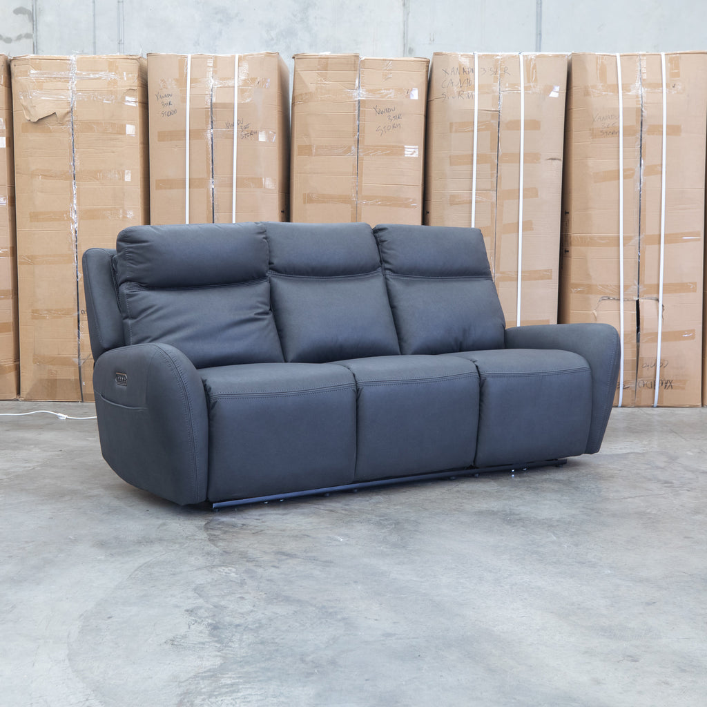 The Palm Cove Three Seater Triple Motor Electric Recliner Lounge - Coal available to purchase from Warehouse Furniture Clearance at our next sale event.