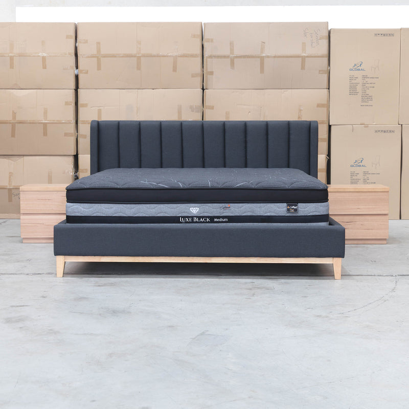 The Paros King Upholstered Bed - Charcoal available to purchase from Warehouse Furniture Clearance at our next sale event.