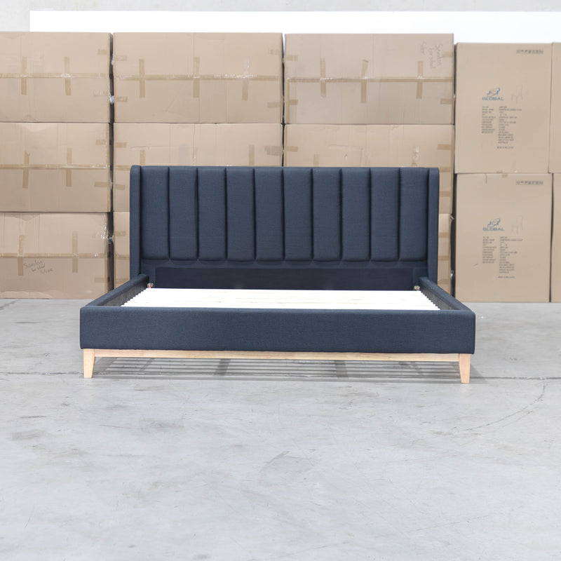 The Paros King Upholstered Bed - Charcoal available to purchase from Warehouse Furniture Clearance at our next sale event.