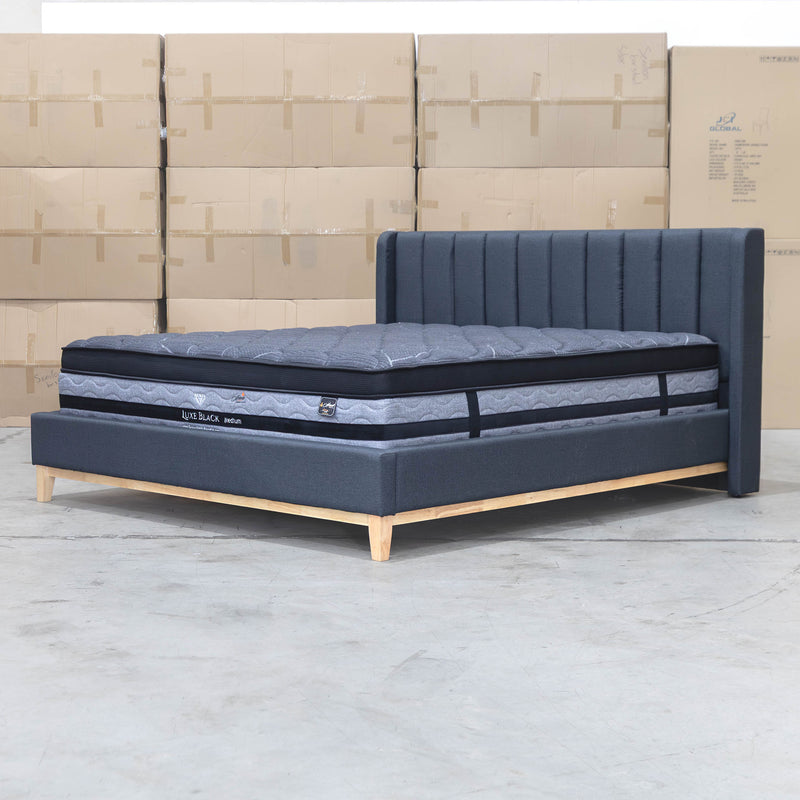 The Paros King Upholstered Bed - Charcoal available to purchase from Warehouse Furniture Clearance at our next sale event.