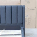 The Paros King Upholstered Bed - Charcoal available to purchase from Warehouse Furniture Clearance at our next sale event.