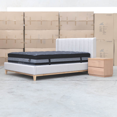 The Paros King Upholstered Bed - Oat White available to purchase from Warehouse Furniture Clearance at our next sale event.