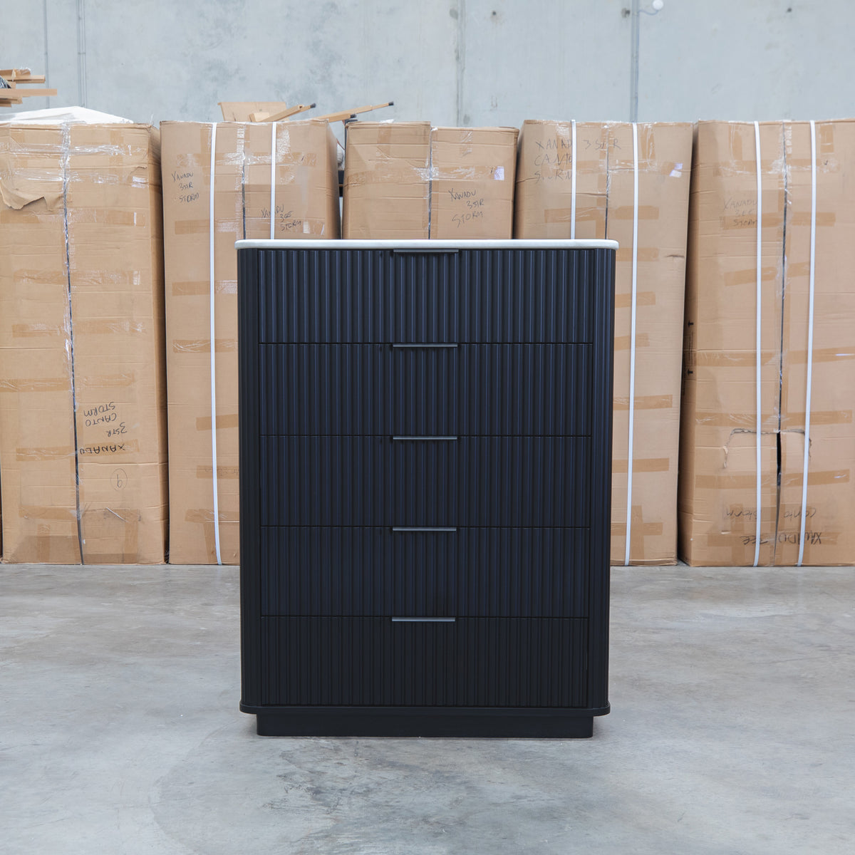 The Province Five Drawer Tallboy - Black & White Jazz Top available to purchase from Warehouse Furniture Clearance at our next sale event.