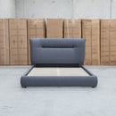 The Quinn Queen Upholstered Bed - Charcoal available to purchase from Warehouse Furniture Clearance at our next sale event.