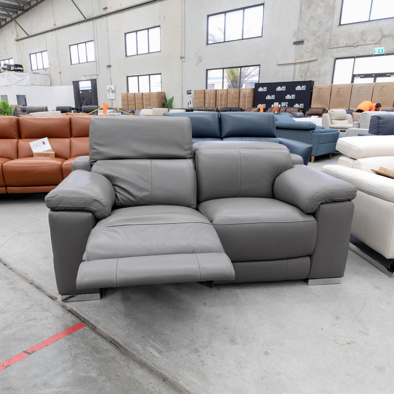 The RS-11583-PR Two seat full leather dual motor recliner - Elephant - Floor Stock available to purchase from Warehouse Furniture Clearance at our next sale event.