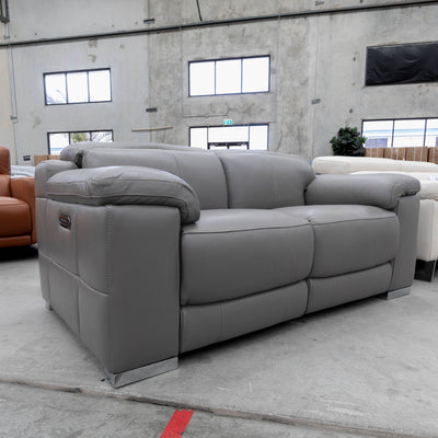 The RS-11583-PR Two seat full leather dual motor recliner - Elephant - Floor Stock available to purchase from Warehouse Furniture Clearance at our next sale event.