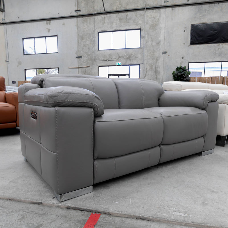 The RS-11583-PR Two seat full leather dual motor recliner - Elephant - Floor Stock available to purchase from Warehouse Furniture Clearance at our next sale event.