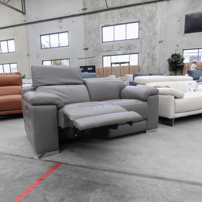 The RS-11583-PR Two seat full leather dual motor recliner - Elephant - Floor Stock available to purchase from Warehouse Furniture Clearance at our next sale event.