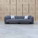 The Raven Curved Four Seat Sofa - Charcoal available to purchase from Warehouse Furniture Clearance at our next sale event.