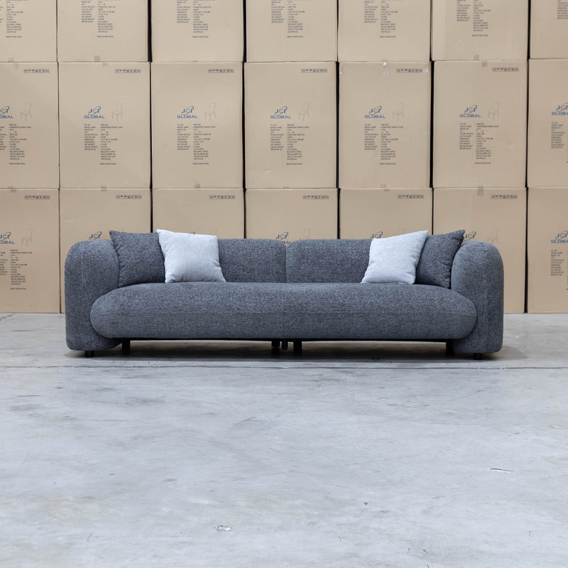 The Raven Curved Four Seat Sofa - Charcoal available to purchase from Warehouse Furniture Clearance at our next sale event.