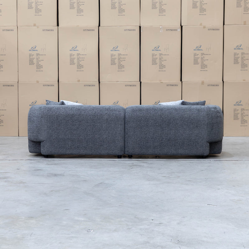 The Raven Curved Four Seat Sofa - Charcoal available to purchase from Warehouse Furniture Clearance at our next sale event.