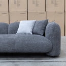The Raven Curved Three Seat Sofa - Charcoal available to purchase from Warehouse Furniture Clearance at our next sale event.