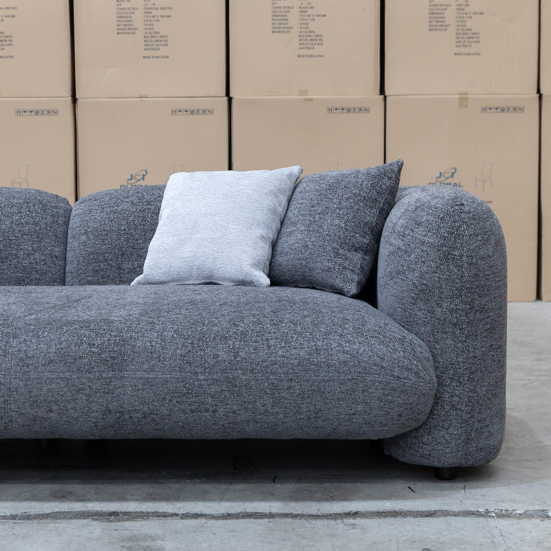 The Raven Curved Three Seat Sofa - Charcoal available to purchase from Warehouse Furniture Clearance at our next sale event.
