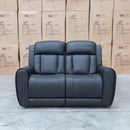 The Lauria Leather Two Seat Triple Motor Recliner Lounge with Air Massager - Black available to purchase from Warehouse Furniture Clearance at our next sale event.