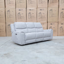 The Connor Three Seat Single Motor Electric Recliner Lounge - Light Grey available to purchase from Warehouse Furniture Clearance at our next sale event.