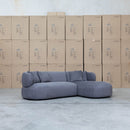 The Rhodes Curved Three Seat Chaise Lounge - Charcoal available to purchase from Warehouse Furniture Clearance at our next sale event.