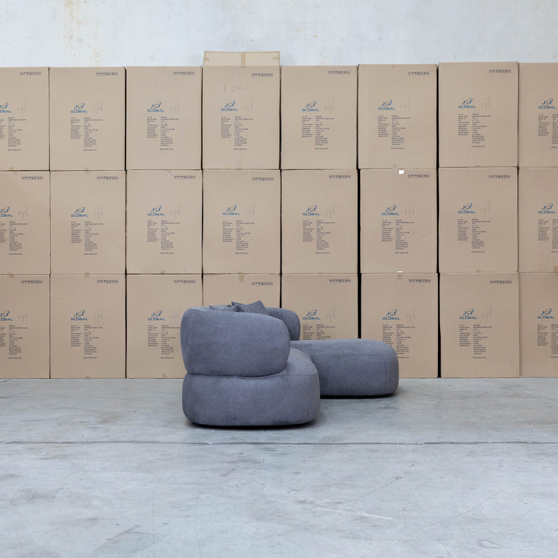 The Rhodes Curved Three Seat Chaise Lounge - Charcoal available to purchase from Warehouse Furniture Clearance at our next sale event.