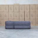 The Rhodes Curved Three Seat Chaise Lounge - Charcoal available to purchase from Warehouse Furniture Clearance at our next sale event.