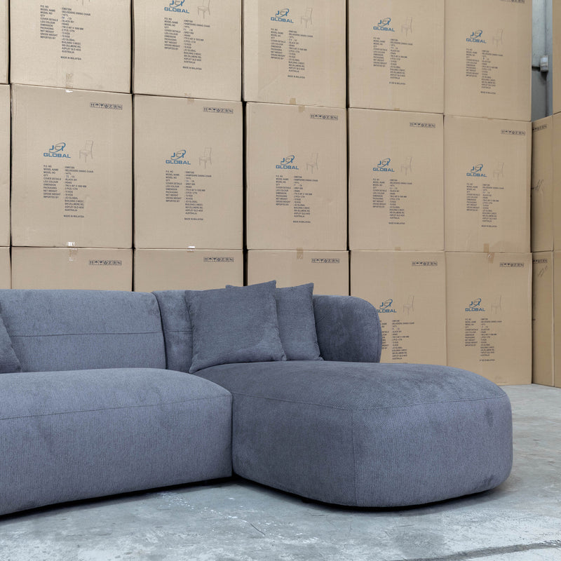 The Rhodes Curved Three Seat Chaise Lounge - Charcoal available to purchase from Warehouse Furniture Clearance at our next sale event.