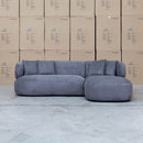 The Rhodes Curved Three Seat Chaise Lounge - Charcoal available to purchase from Warehouse Furniture Clearance at our next sale event.