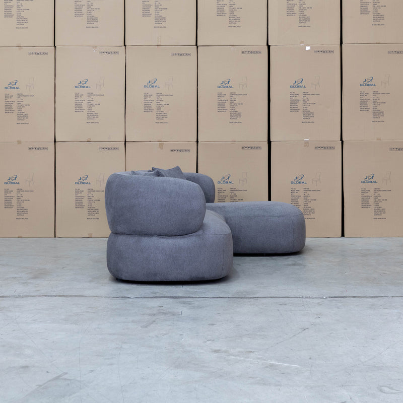 The Rhodes Curved Three Seat Chaise Lounge - Charcoal available to purchase from Warehouse Furniture Clearance at our next sale event.
