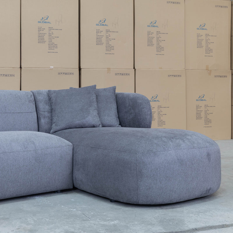 The Rhodes Curved Three Seat Chaise Lounge - Charcoal available to purchase from Warehouse Furniture Clearance at our next sale event.
