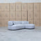 The Rhodes Curved Three Seat Chaise Lounge - Pewter available to purchase from Warehouse Furniture Clearance at our next sale event.