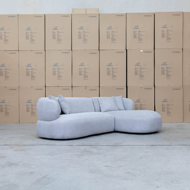 The Rhodes Curved Three Seat Chaise Lounge - Pewter available to purchase from Warehouse Furniture Clearance at our next sale event.