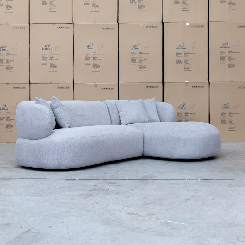The Rhodes Curved Three Seat Chaise Lounge - Pewter available to purchase from Warehouse Furniture Clearance at our next sale event.
