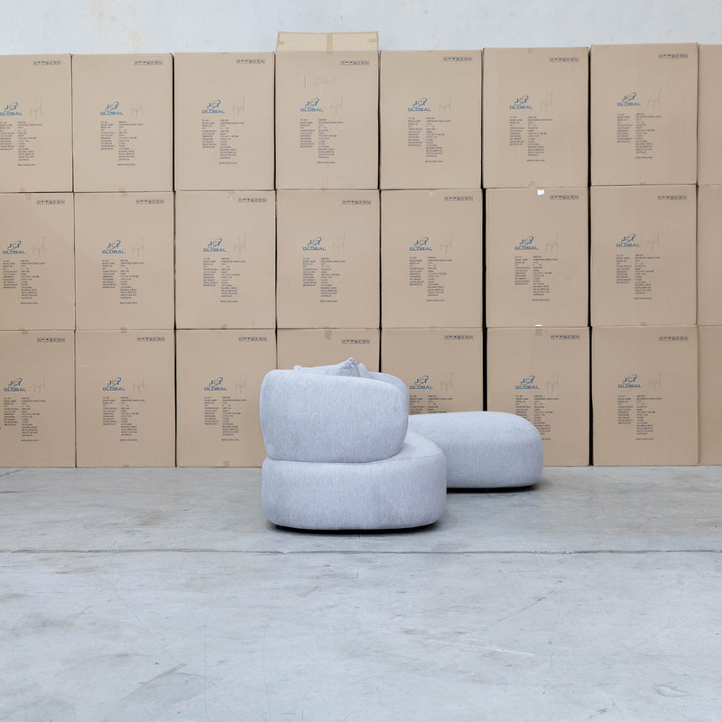 The Rhodes Curved Three Seat Chaise Lounge - Pewter available to purchase from Warehouse Furniture Clearance at our next sale event.