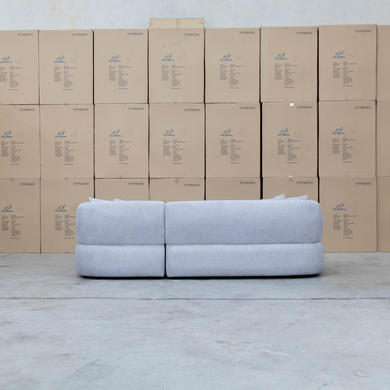 The Rhodes Curved Three Seat Chaise Lounge - Pewter available to purchase from Warehouse Furniture Clearance at our next sale event.