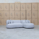 The Rhodes Curved Three Seat Chaise Lounge - Pewter available to purchase from Warehouse Furniture Clearance at our next sale event.