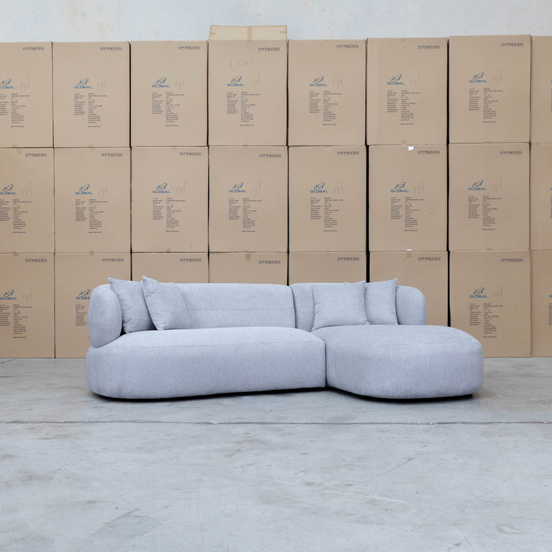 The Rhodes Curved Three Seat Chaise Lounge - Pewter available to purchase from Warehouse Furniture Clearance at our next sale event.