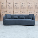 The Santorini Curved Three Seat Sofa - Lance Charcoal available to purchase from Warehouse Furniture Clearance at our next sale event.