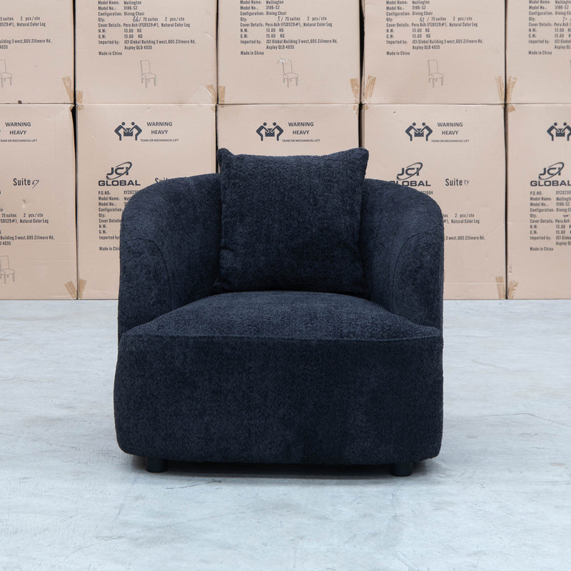 The Santorini Curved Arm Chair - Boucle Black available to purchase from Warehouse Furniture Clearance at our next sale event.