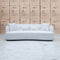 The Santorini Curved Three Seat Sofa - Boucle Ivory available to purchase from Warehouse Furniture Clearance at our next sale event.