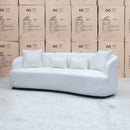 The Santorini Curved Three Seat Sofa - Boucle Ivory available to purchase from Warehouse Furniture Clearance at our next sale event.