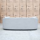 The Santorini Curved Three Seat Sofa - Boucle Ivory available to purchase from Warehouse Furniture Clearance at our next sale event.
