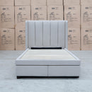 The Hudson King Single Fabric Storage Bed - Oat White available to purchase from Warehouse Furniture Clearance at our next sale event.